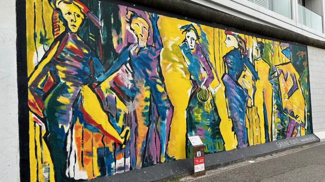 a painting on a section of the Berlin wall