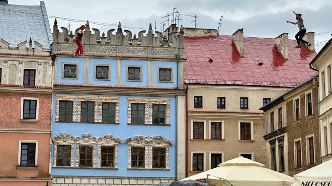 &ldquo;a man and a woman, each walking a highline strung between buildings&rdquo;
